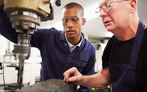 training a new worker in a manufacturing facility